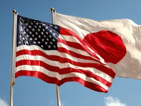 Flagi USA i Japonii powiewające na wietrze